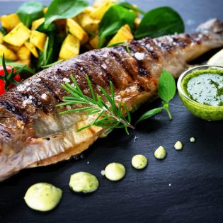 Grilled trout with potato and spinach